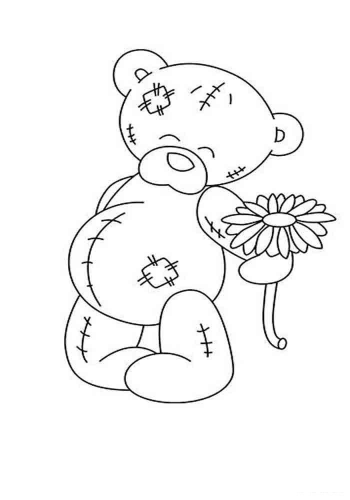 Oso de peluche con una flor