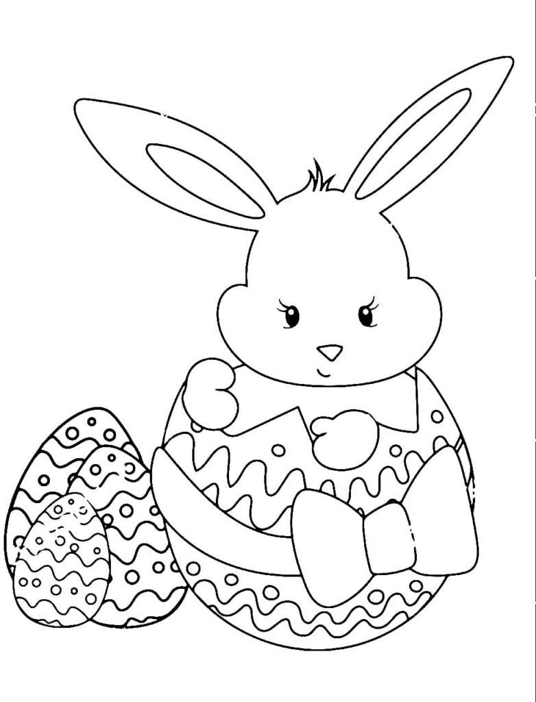 El conejito se sienta en un huevo de Pascua