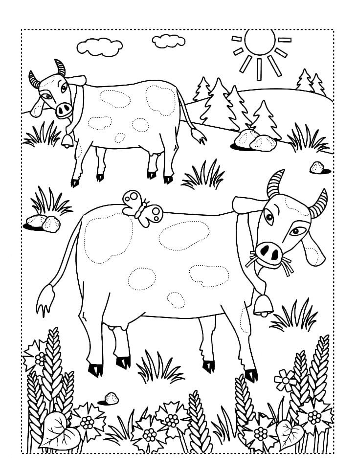 Dos hermosas vacas comen hierba