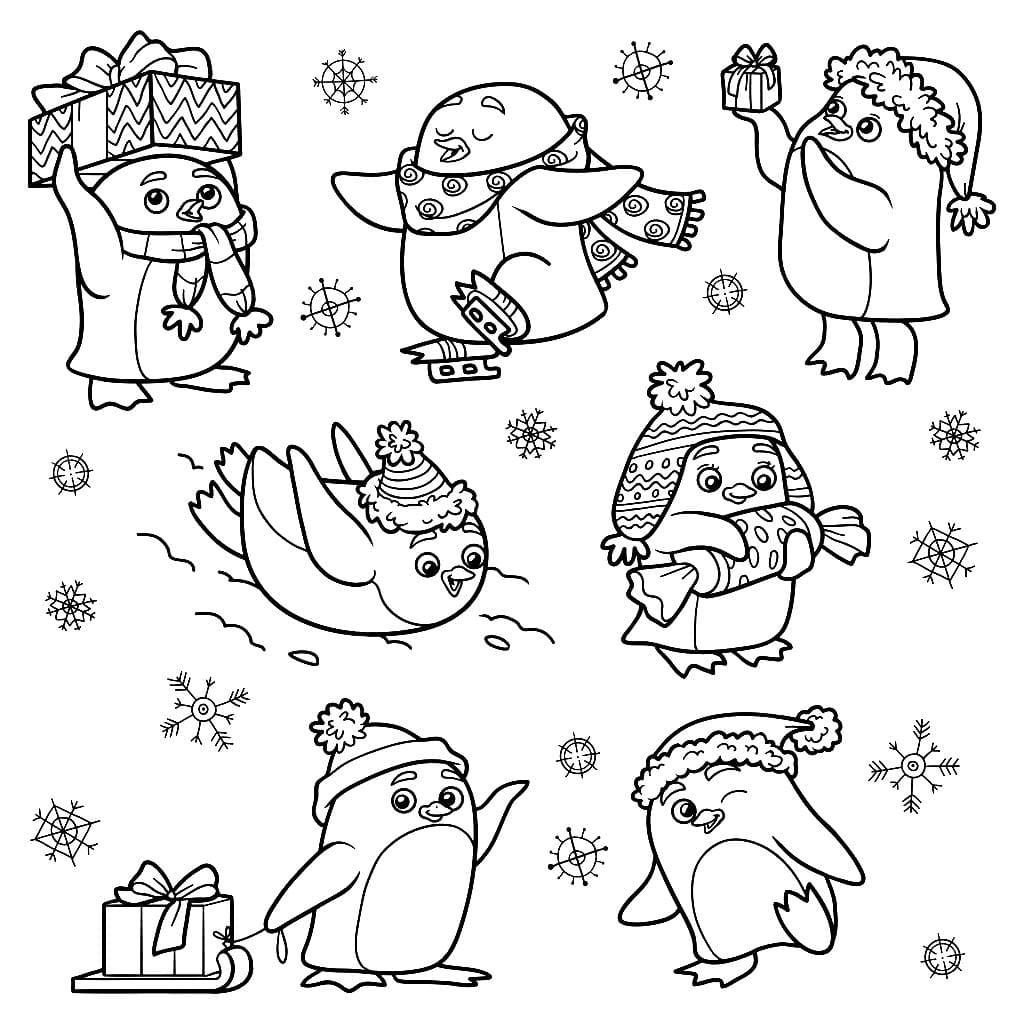 Los pingüinos divertidos se regocijan en invierno