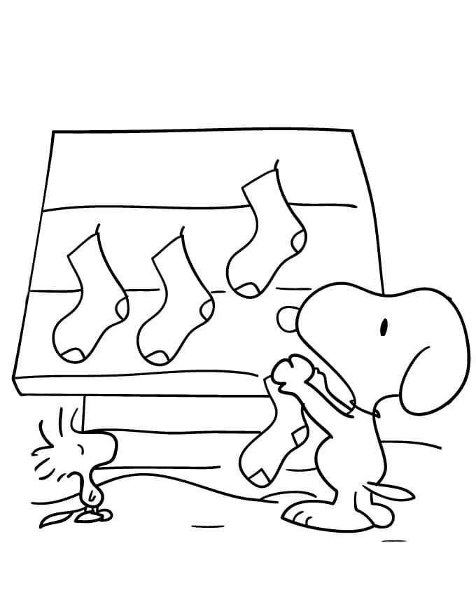 Snoopy cuelga calcetines navideÃ±os